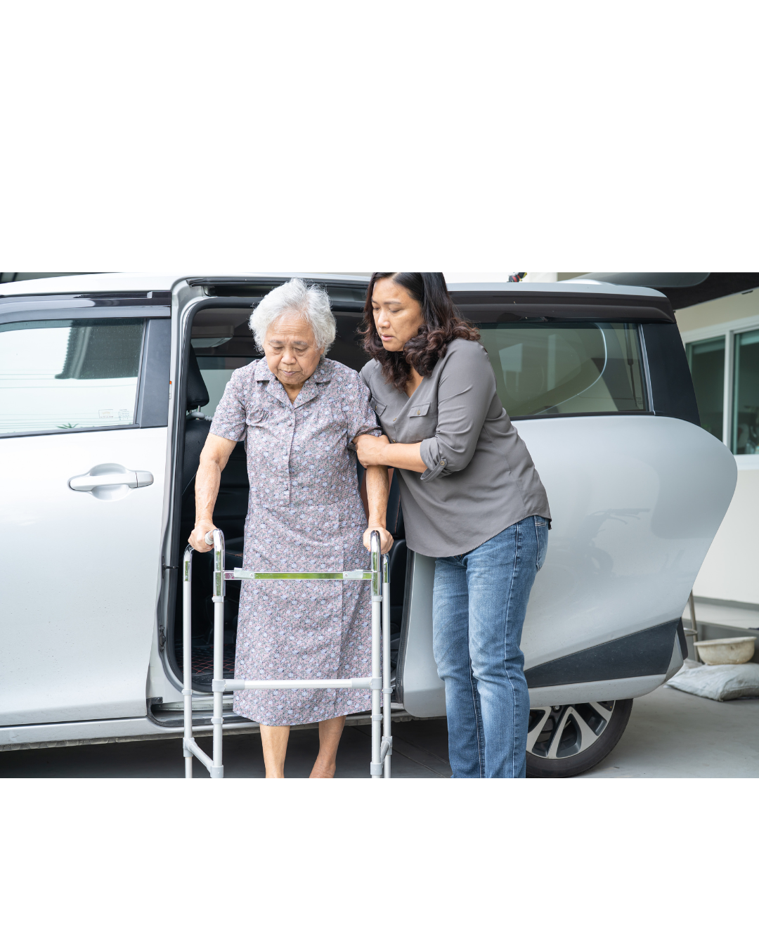 Caregiver assisting a senior with safe transportation